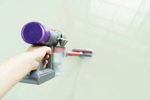 clean floor with a vacuum cleaner at home